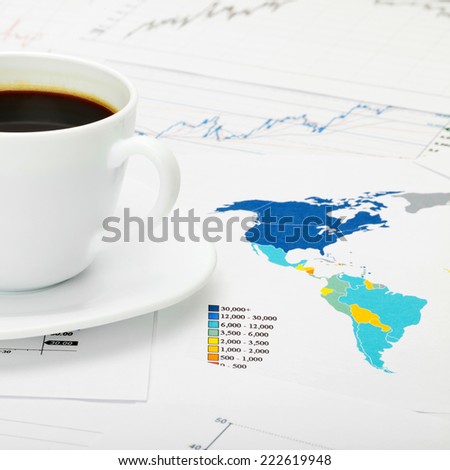 Coffee cup over world map - 1 to 1 ratio