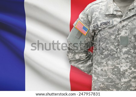 American soldier with flag on background - France
