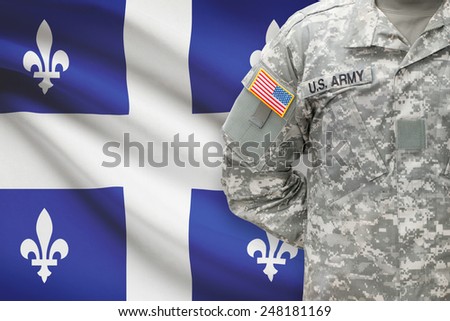 American soldier with Canadian province flag on background - Quebec