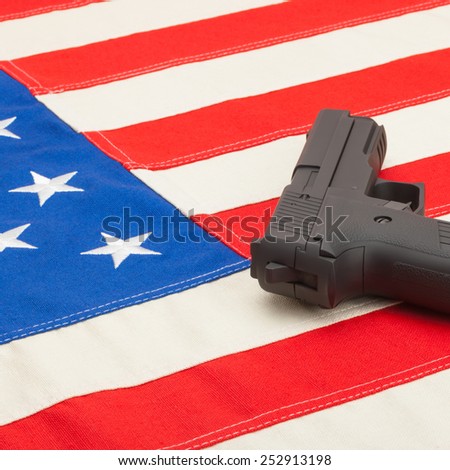 Handgun over US flag - studio  shoot