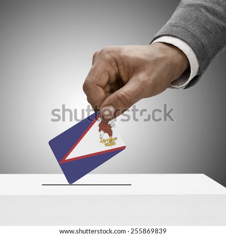 Black male holding flag. Voting concept - American Samoa
