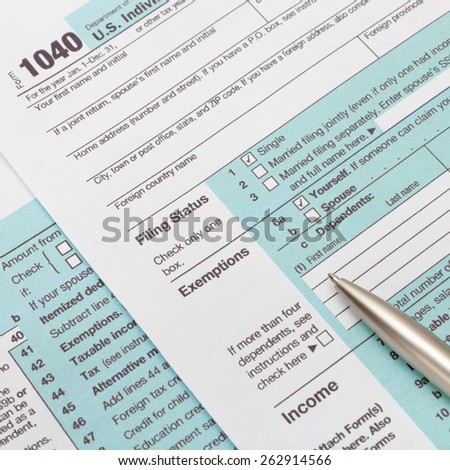 US 1040 Tax Form and silver ball pen