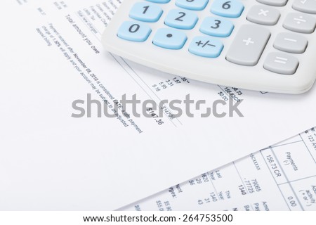 Calculator with monthly utility bill under it