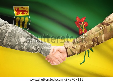 Soldiers handshake and Canadian province flag - Saskatchewan