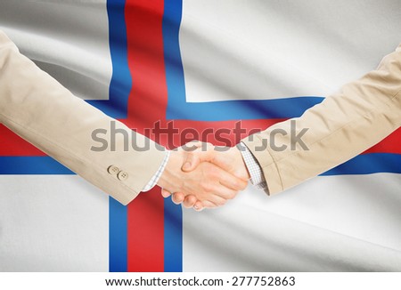 Businessmen shaking hands with flag on background - Faroe Islands