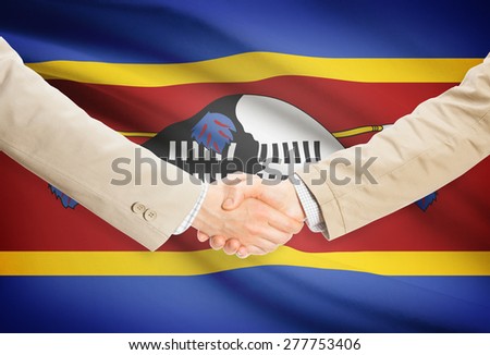 Businessmen shaking hands with flag on background - Swaziland