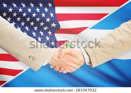 Businessmen shaking hands - United States and Nicaragua