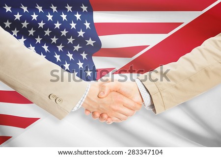 Businessmen shaking hands - United States and Monaco