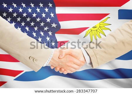 Businessmen shaking hands - United States and Uruguay