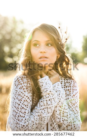 Beautiful lady model in open field at sunrise