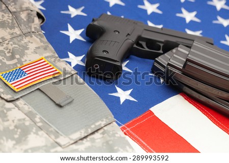 Handgun over US flag - close up shoot