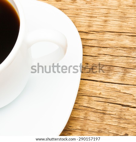 Fresh expresso on old wooden table - shot from top