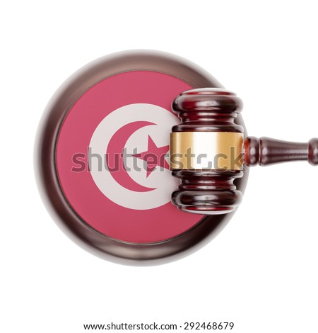 National legal system concept with flag on sound block  - Tunisia
