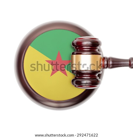 National legal system concept with flag on sound block  - French Guiana