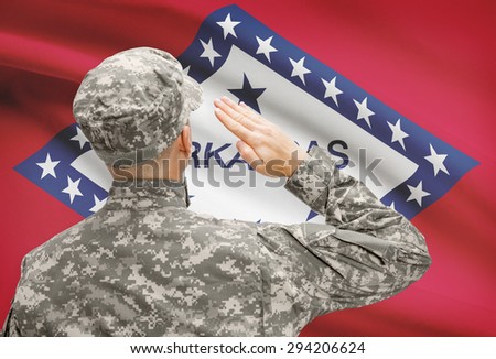 Soldier saluting to USA state flag conceptual series - Arkansas
