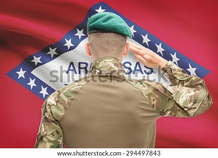 Soldier saluting to US state flag series - Arkansas