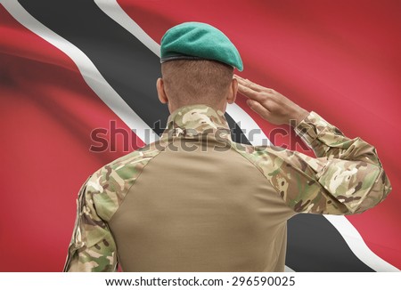 Dark-skinned soldier in hat facing national flag series - Trinidad and Tobago