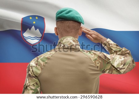 Dark-skinned soldier in hat facing national flag series - Slovenia