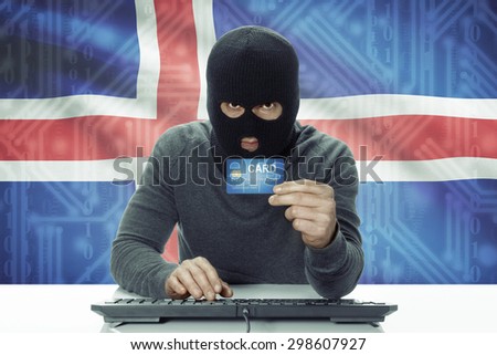 Dark-skinned hacker with credit card and flag on background - Iceland