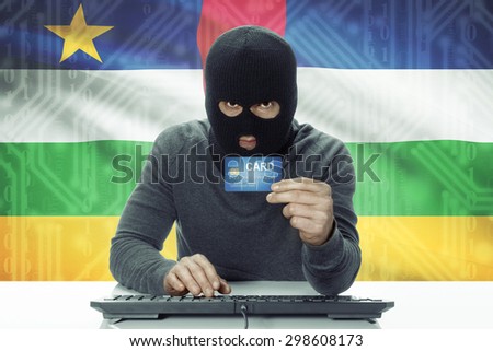 Dark-skinned hacker with credit card and flag on background - Central African Republic