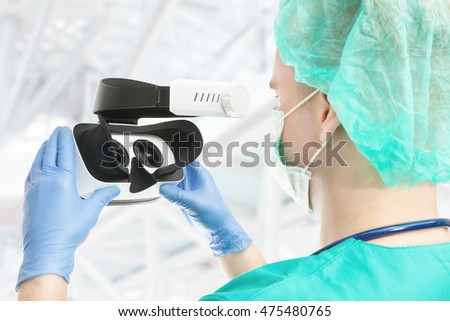Doctor with virtual reality glasses on white background