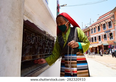 Kathmandu Nepal - May 12 2015 : Old woman pray for nepal  after earthquake disaster