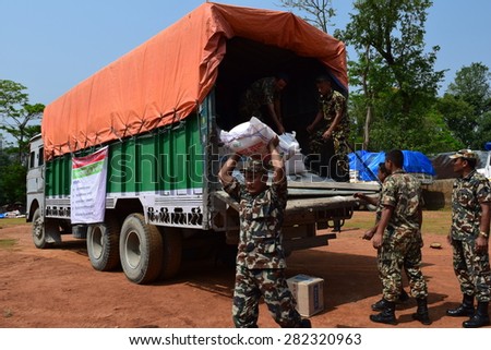 Dhading district Nepal - May 10 2015 :Soldier distribute food for Nepal earthquake victims