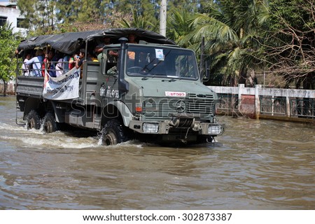 Bangkok,Thailand - October 2011 : Soldier trucks help people , Huge flood disaster in Thailand