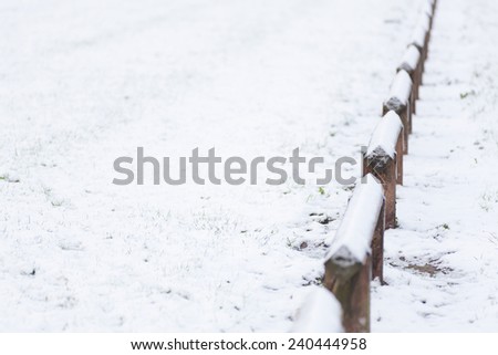 Snow background and wooden fence
