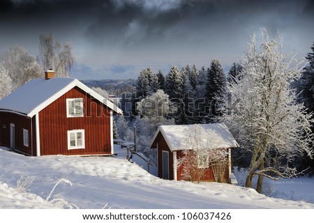 small red cottages, cabins in snowy winter season, scenery from sweden, dark clouds at horizon