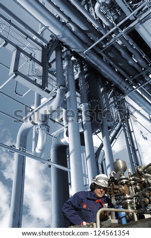oil, fuel and gas works, refinery worker with pipelines machinery