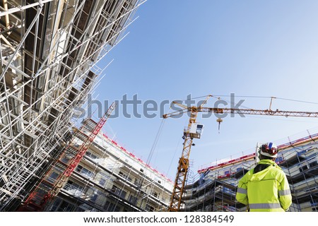 Surveyor With Instrument, Surveying Large Building-Site, Super-.Wide Perspective