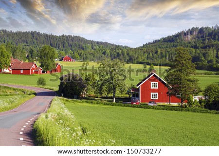 small red farms in old rural setting, fields and forest