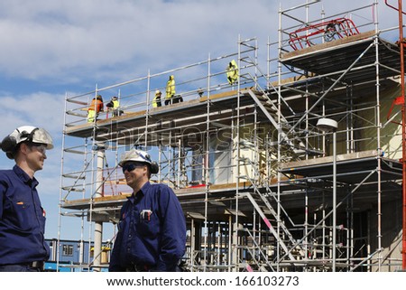 construction workers, scaffolding and building-site