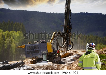 surveyor measuring rock-drilling for dynamiting, civil-engineering