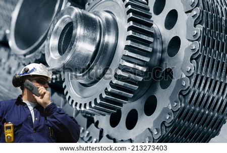 mechanic, worker with power driven cogwheels machinery, steel and metal industry