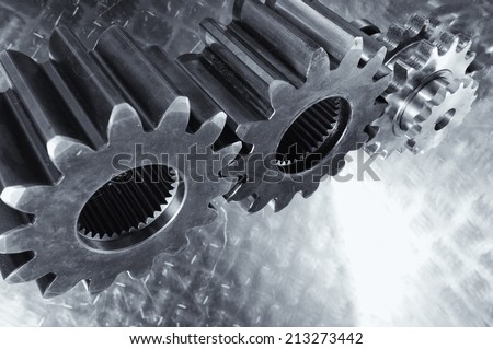 aerospace gears and cogwheels set against light titanium background