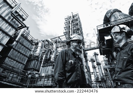 oil and gas engineers inside chemical oil refinery