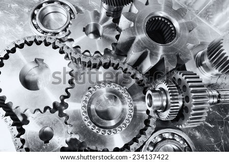 engineering, cogwheels, gears and chains, titanium and steel