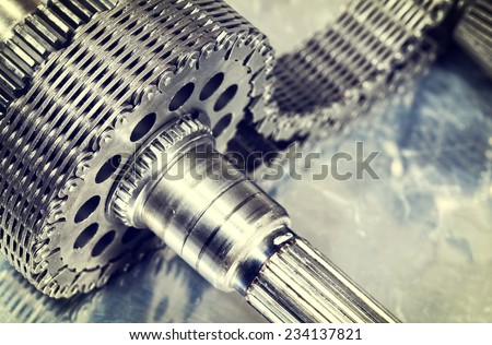 large cogwheels and gears powered by timing chain, slight analog concept