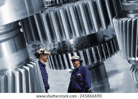 workers, mechanics and large cogwheels machinery, steel industrial.