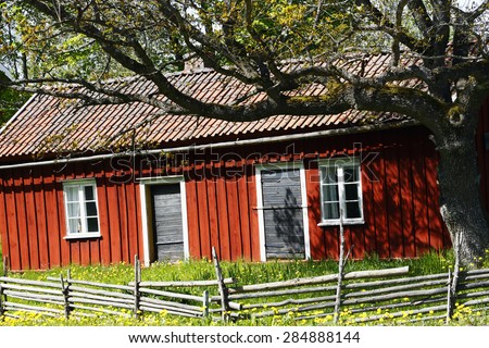 old farm and barn with oak tree, culture from Sweden