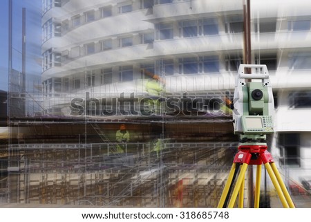 surveying measuring instrument, close-ups,  aimed at building site, zoom effect on background
