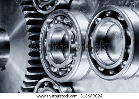 titanium and steel ball-bearings and gears in metallic selenium toning.