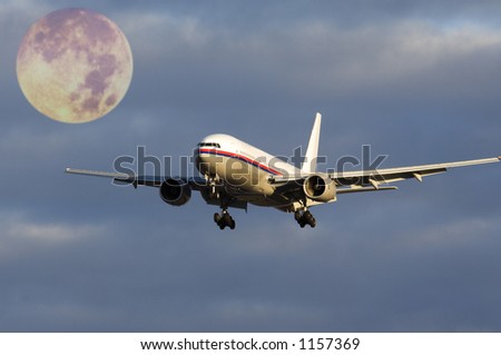 airplane in early evening with moon