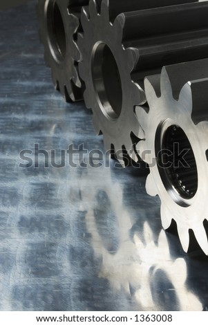 three gears standing on stainless-steel