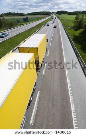 highway with large yellow lorry and traffic, elevated-view