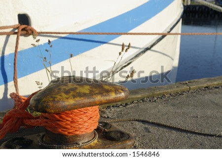 still-life of fishing-boat, rope and pollard