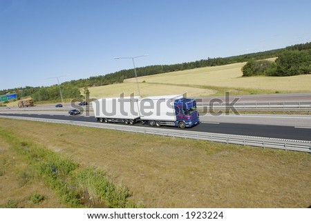 truck, lorry, side-view, driving on highway in countryside