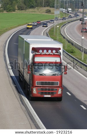 red/white truck, lorry on highway with traffic